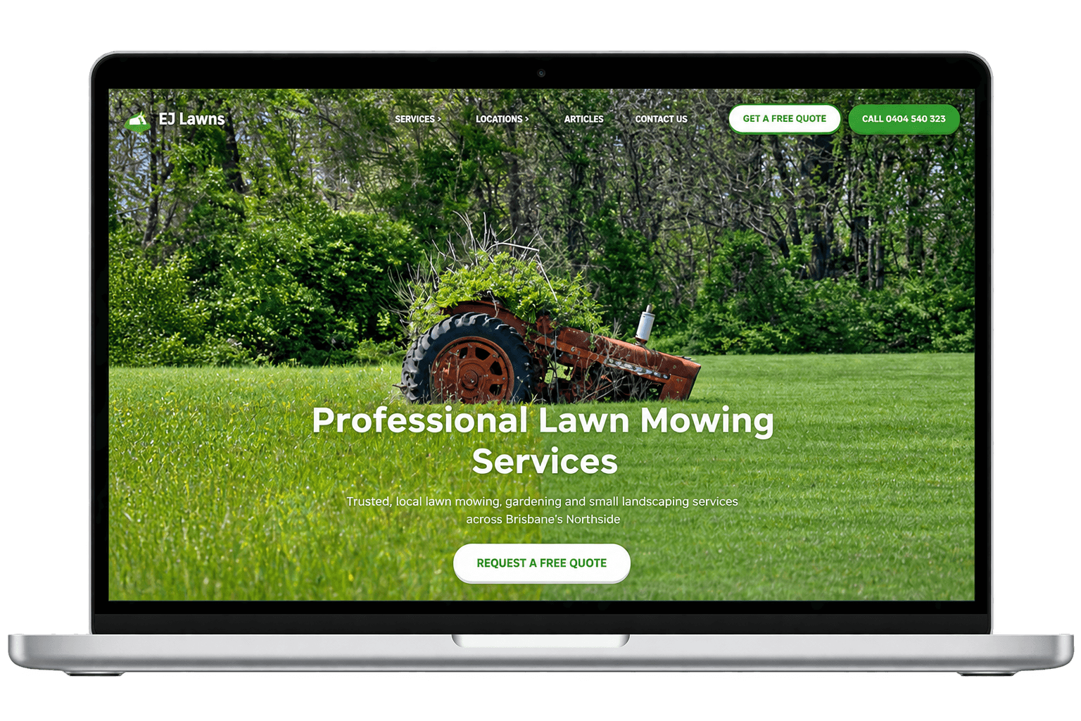 MacBook mockup of the EJ Lawns website, showing its services and quote button.